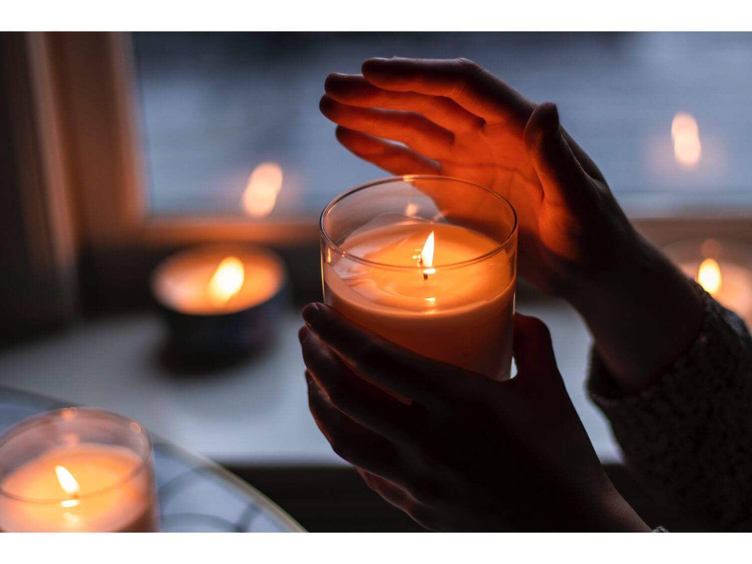 Someone holding a candle