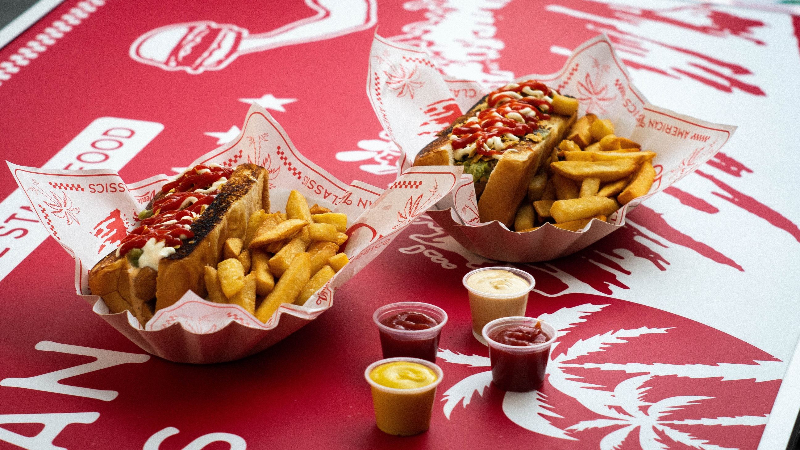 Hot dogs with ketchup and fries 