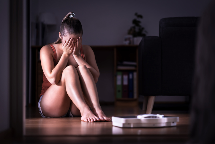 Woman having stress about weight loss, diet or gaining weight. 