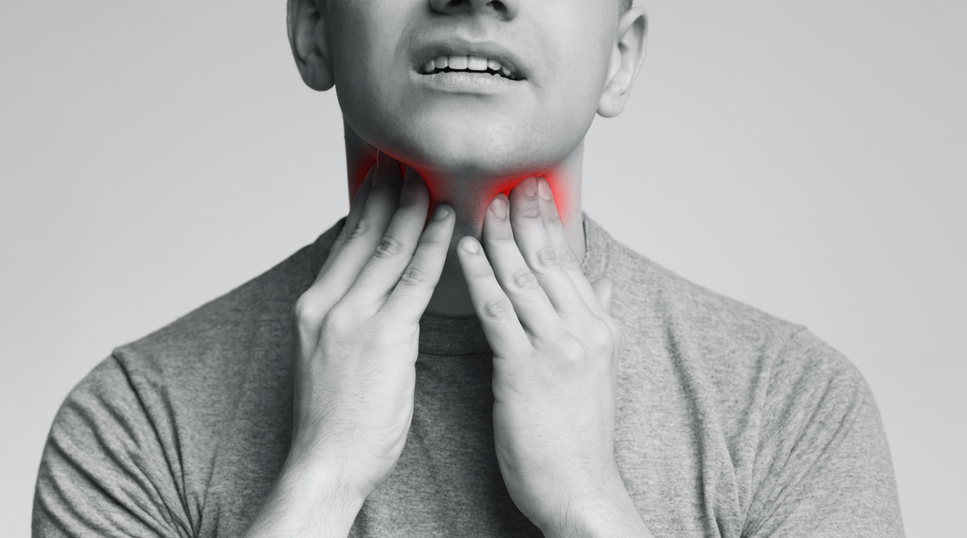 man-touching-neck-thyroid-problem