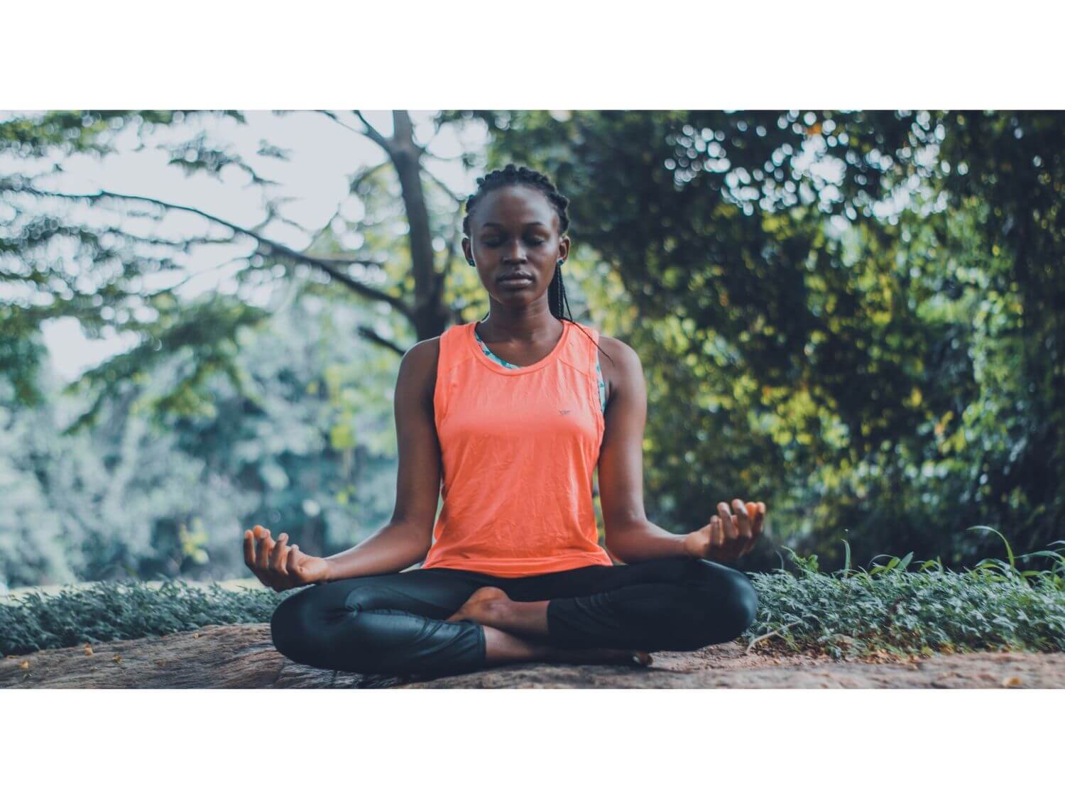 A woman meditating outside