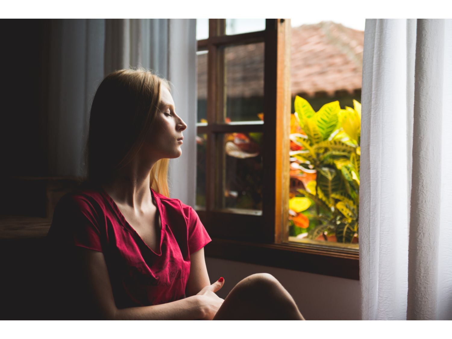 A woman looking out of a window