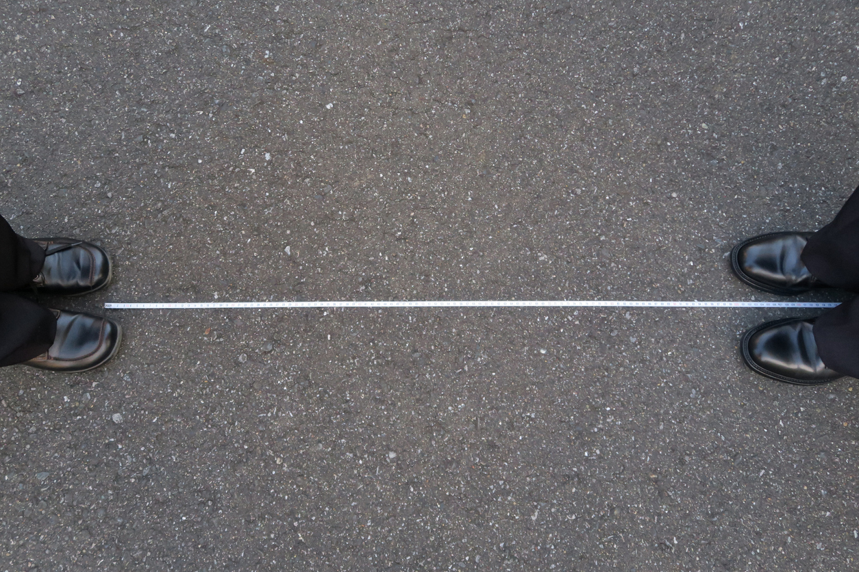 two-people-keeping-a-distance-apart