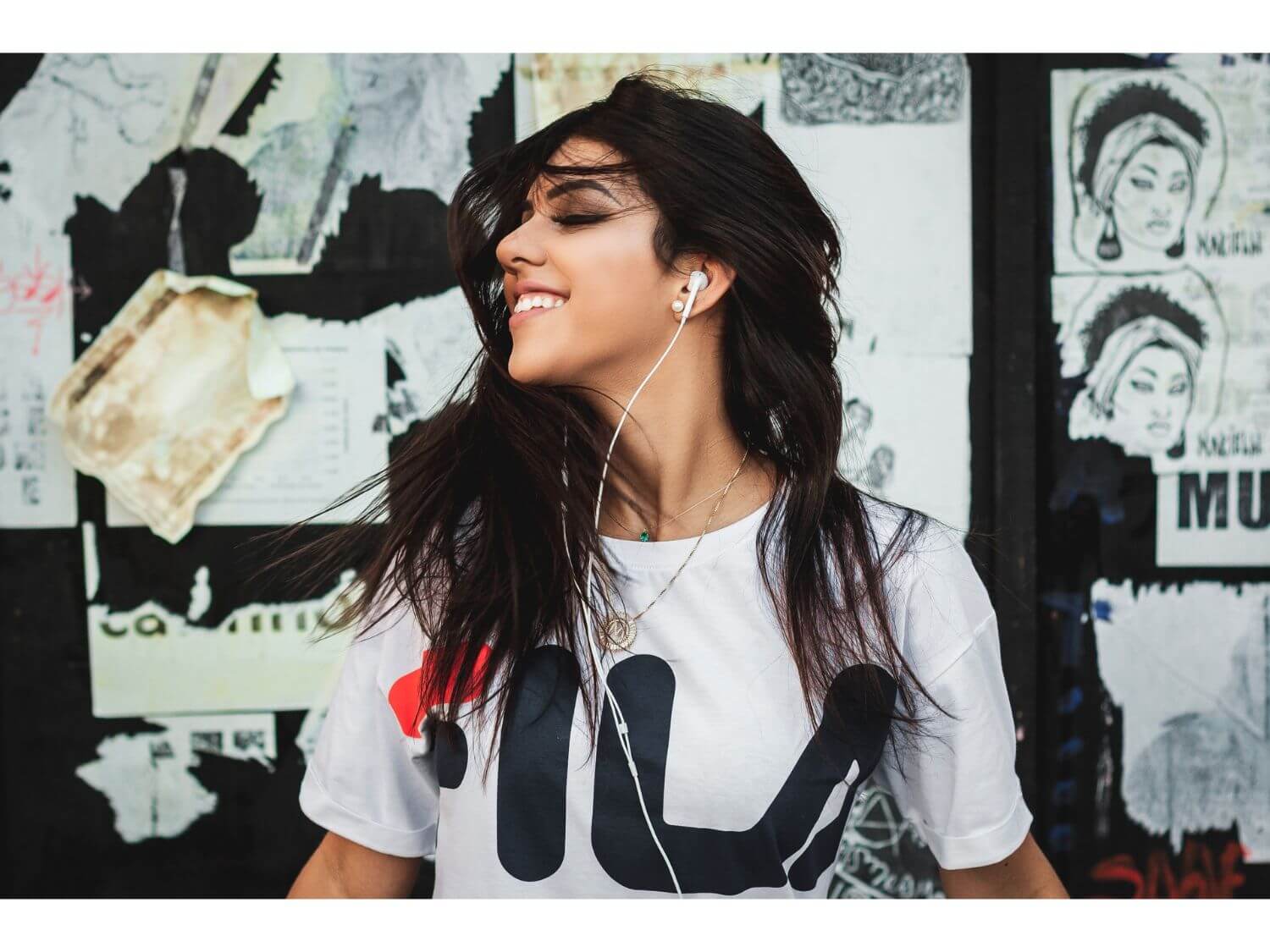 A woman dancing with headphones
