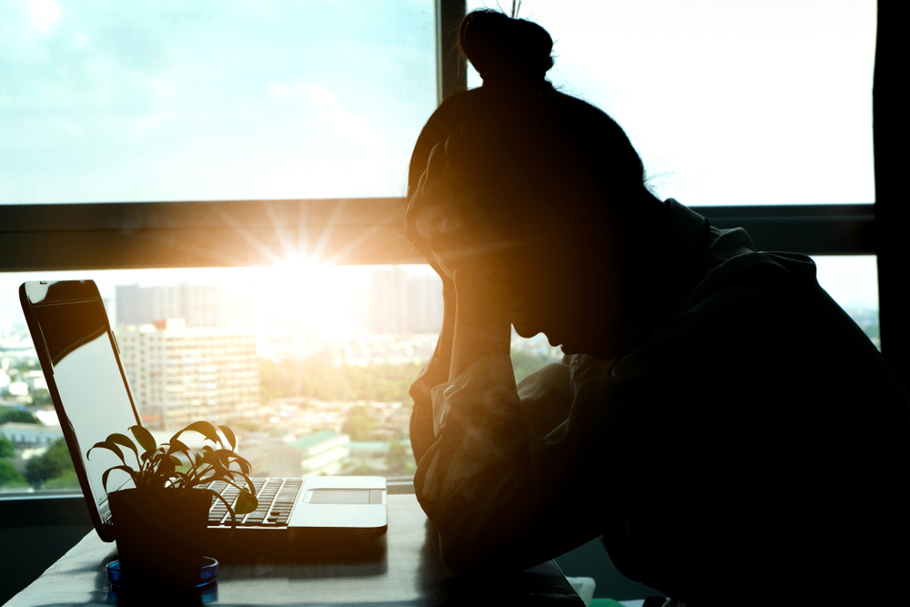 woman-sitting-down-with-headache