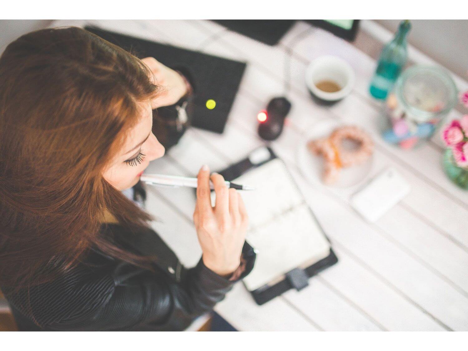 A stressed woman at her desk