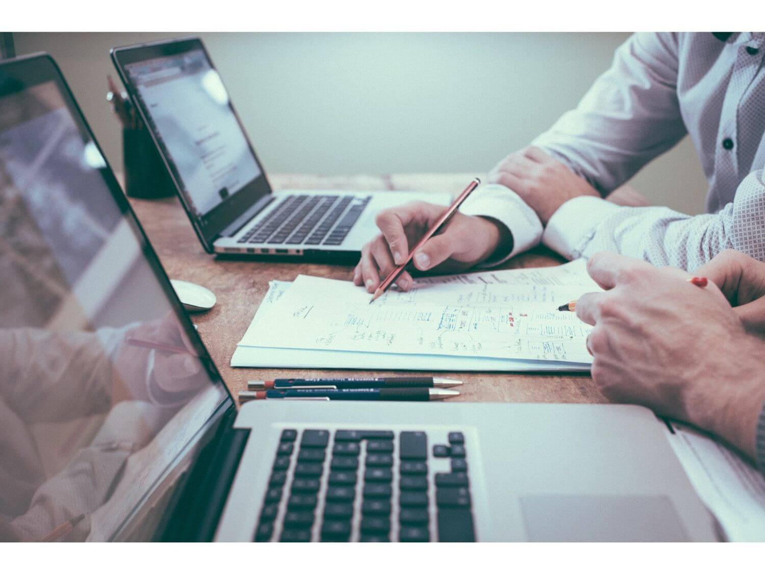 Two people working at desks