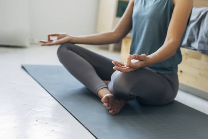 Menopausal woman practising yoga