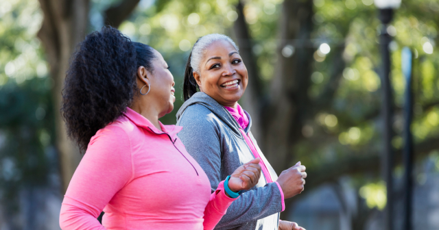 Two friends jogging together showing how to lose weight in menopause