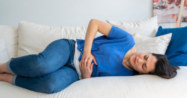 Woman suffering with menopause nausea